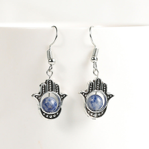 Boucles d'oreilles pendantes rondes et main de hamsa en pierre de cristal naturel