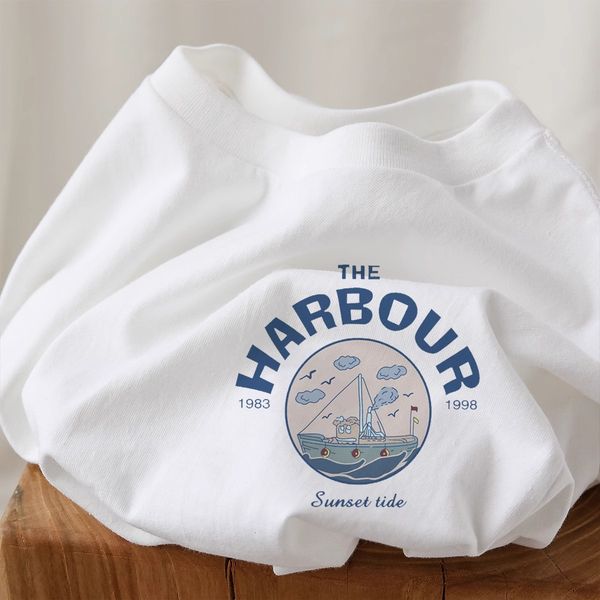 Xinjiang pure cotton bag collar white cartoon printed long sleeved T-shirt for women in autumn winter, with stylish interior and a base laye