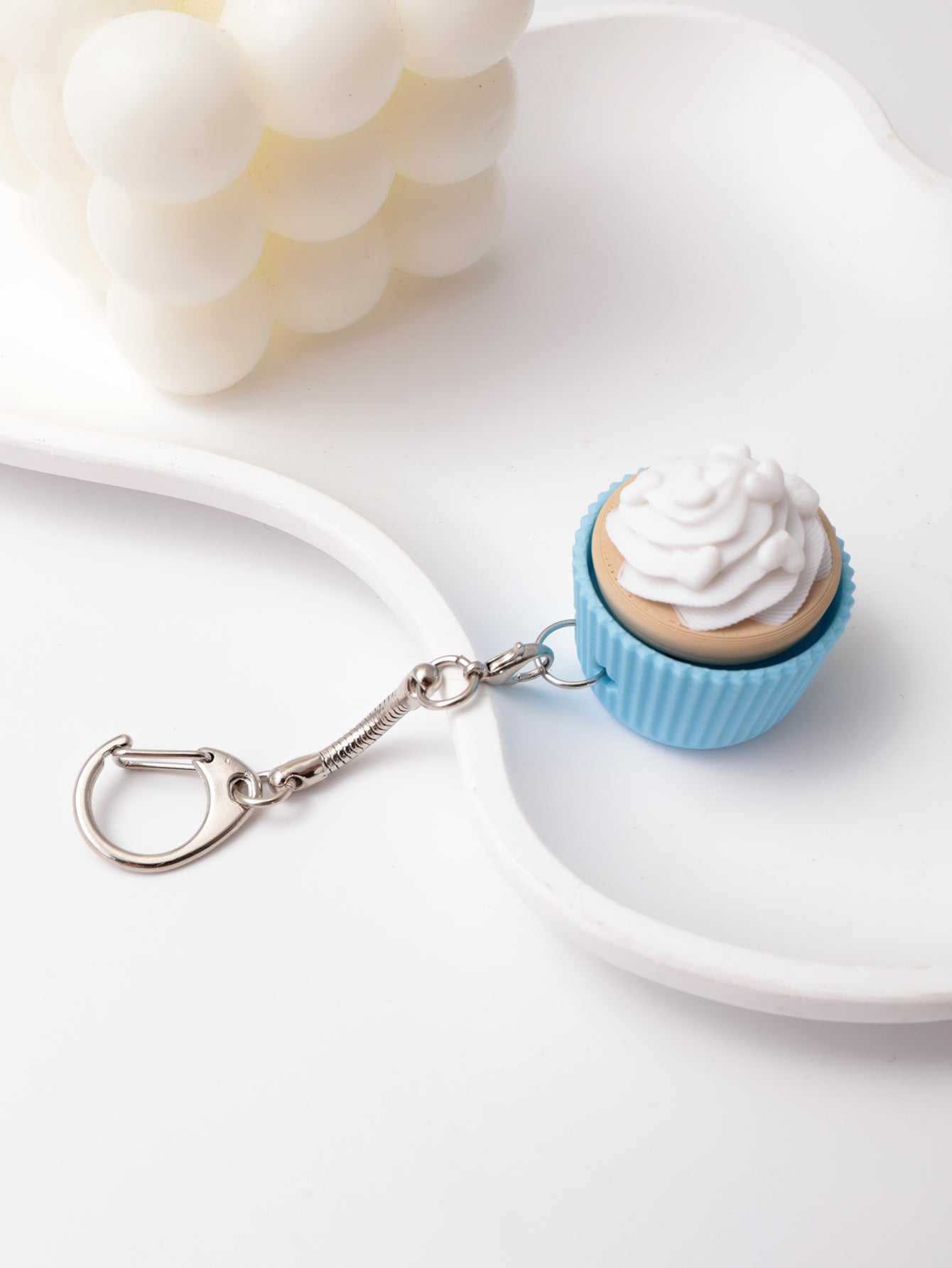 3D printed cupcake-shaped keychain - an adult stress relief toy with a portable anxiety-reducing gadget featuring a clickable keyboard design