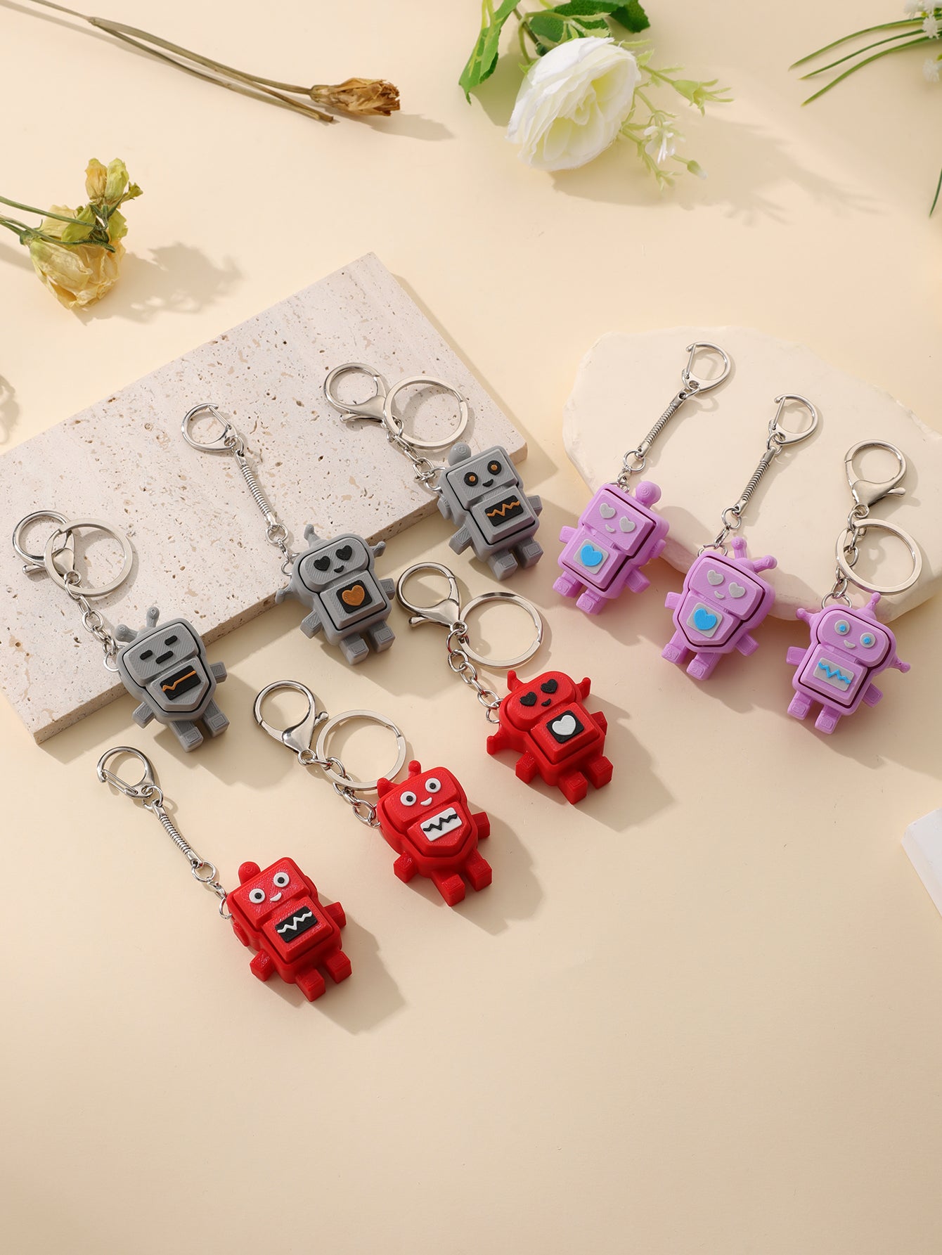 3D printed robot keychain - an adult stress relief toy with a portable anxiety-reducing gadget featuring a clickable keyboard design