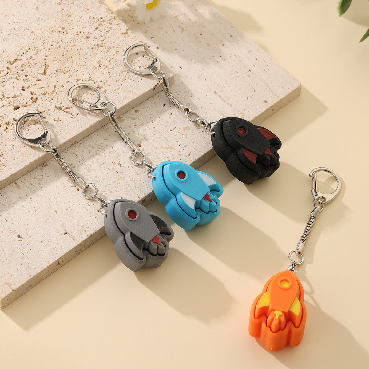 3D printed rocket keychain - an adult stress relief toy with a portable anxiety-reducing gadget featuring a clickable keyboard design