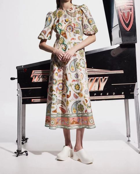 Australian designer linen print romantic floral elegant wrap high waisted bubble sleeves vacation style mid length dress