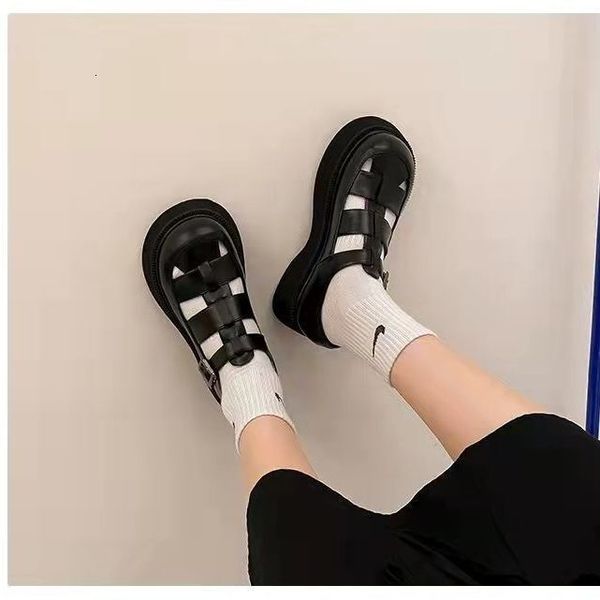 2023 Thick soled Roman sandals, women&#039;s summer woven hollow height sponge cake bun pig cage shoes, wearing black trendy on the outside