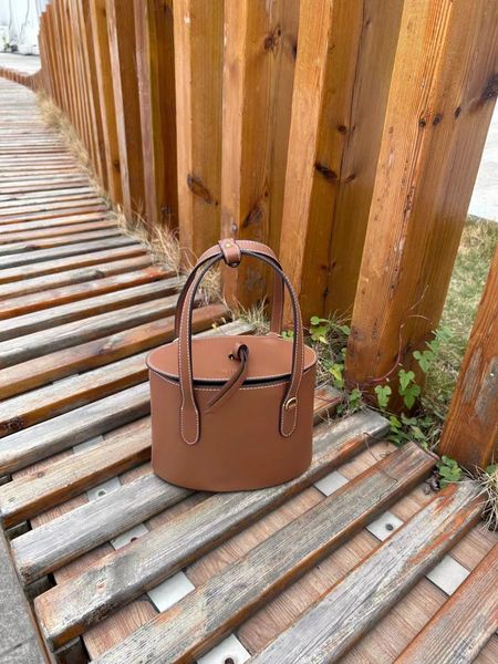 New products launched in 2024, cowhide handbags, classic bucket bag style, mobile phone bag, lipstick bag, cowhide handle, printed micro log