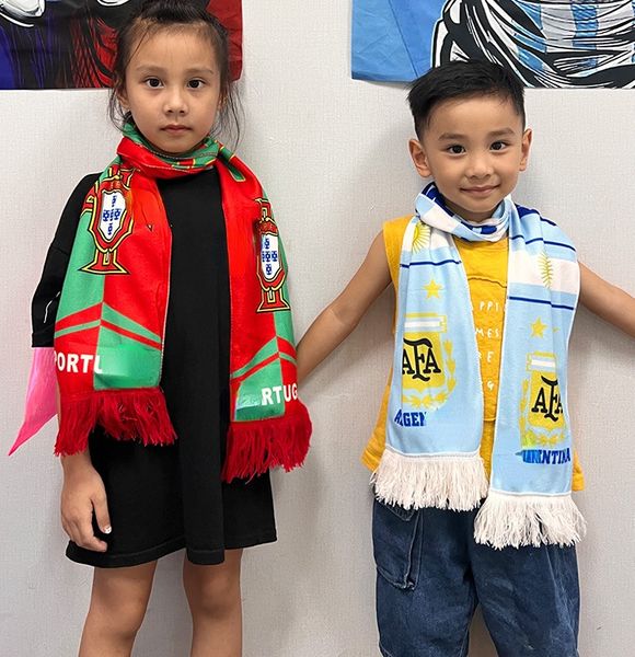 Collectable Soccer Scarves and Bibs Adorn Fans At The 2022 Qatar World Cup