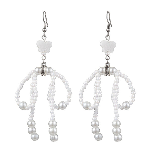 Boucle d'oreille pendante avec nœud papillon avec coquillage naturel étoile et graine de verre