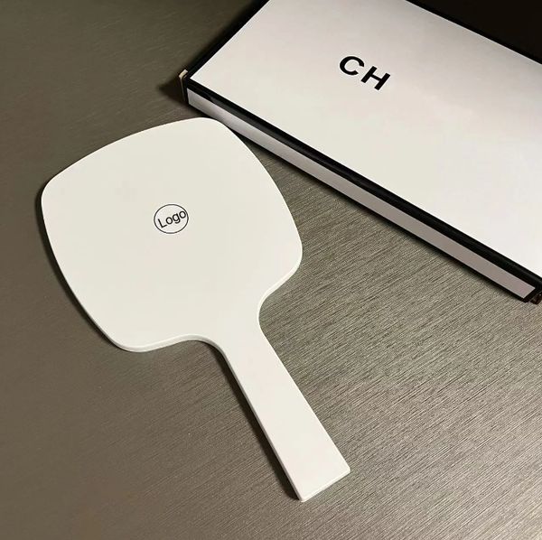 Designer holding makeup mirror black and white classic logo mirror women&#039;s travel portable small mirror essential makeup mirror in bag