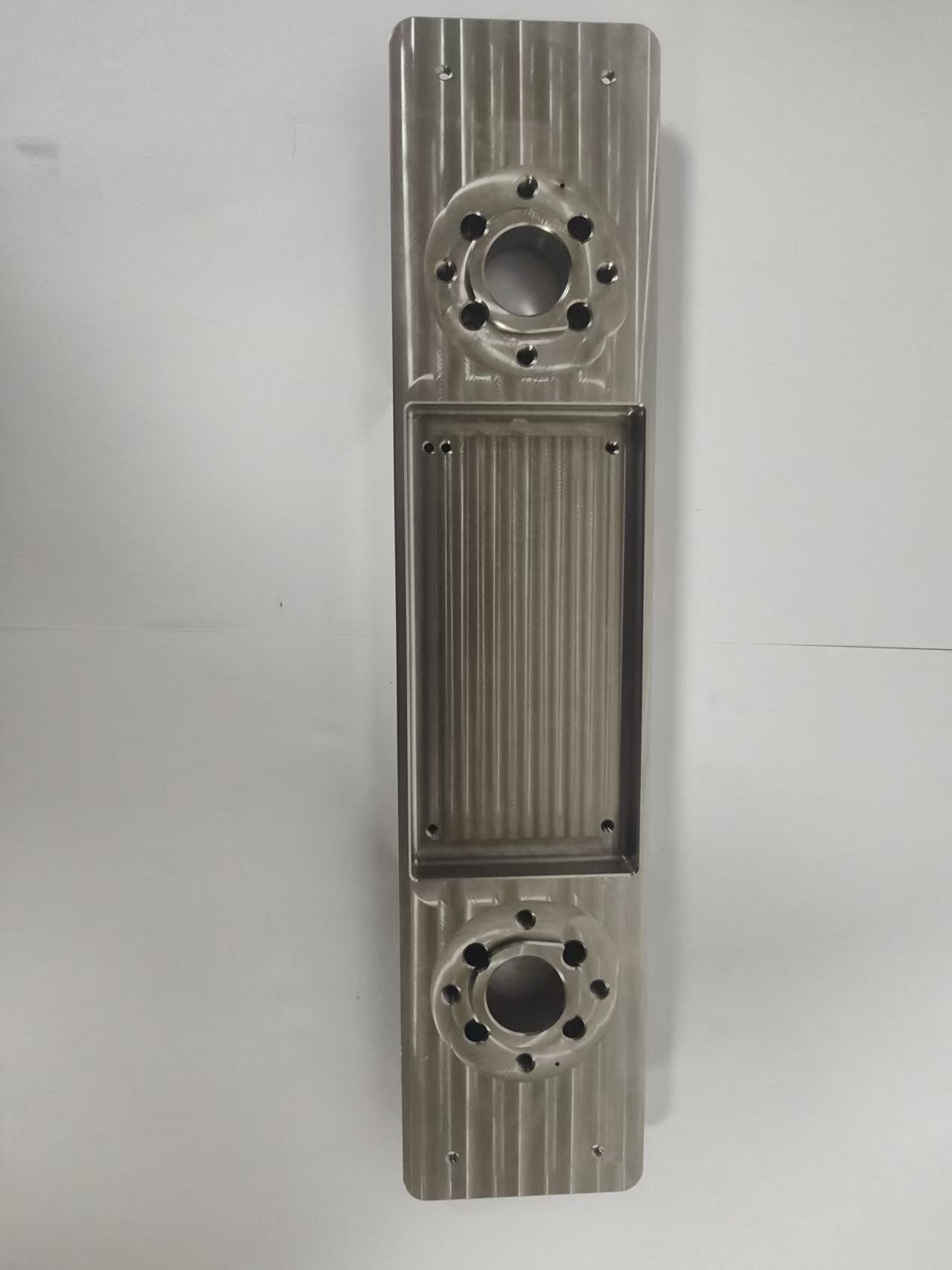 Common Tools Precision - Machined Stainless Steel Mechanical Component with Dual Circular Interfaces and Ribbed Structure H04