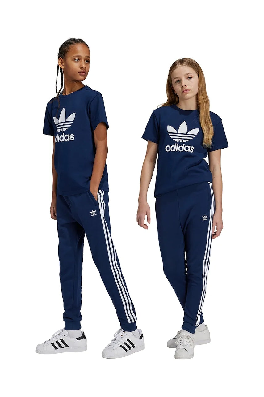 Otroški spodnji del trenirke adidas Originals TREFOIL PANTS mornarsko modra barva, IY7486