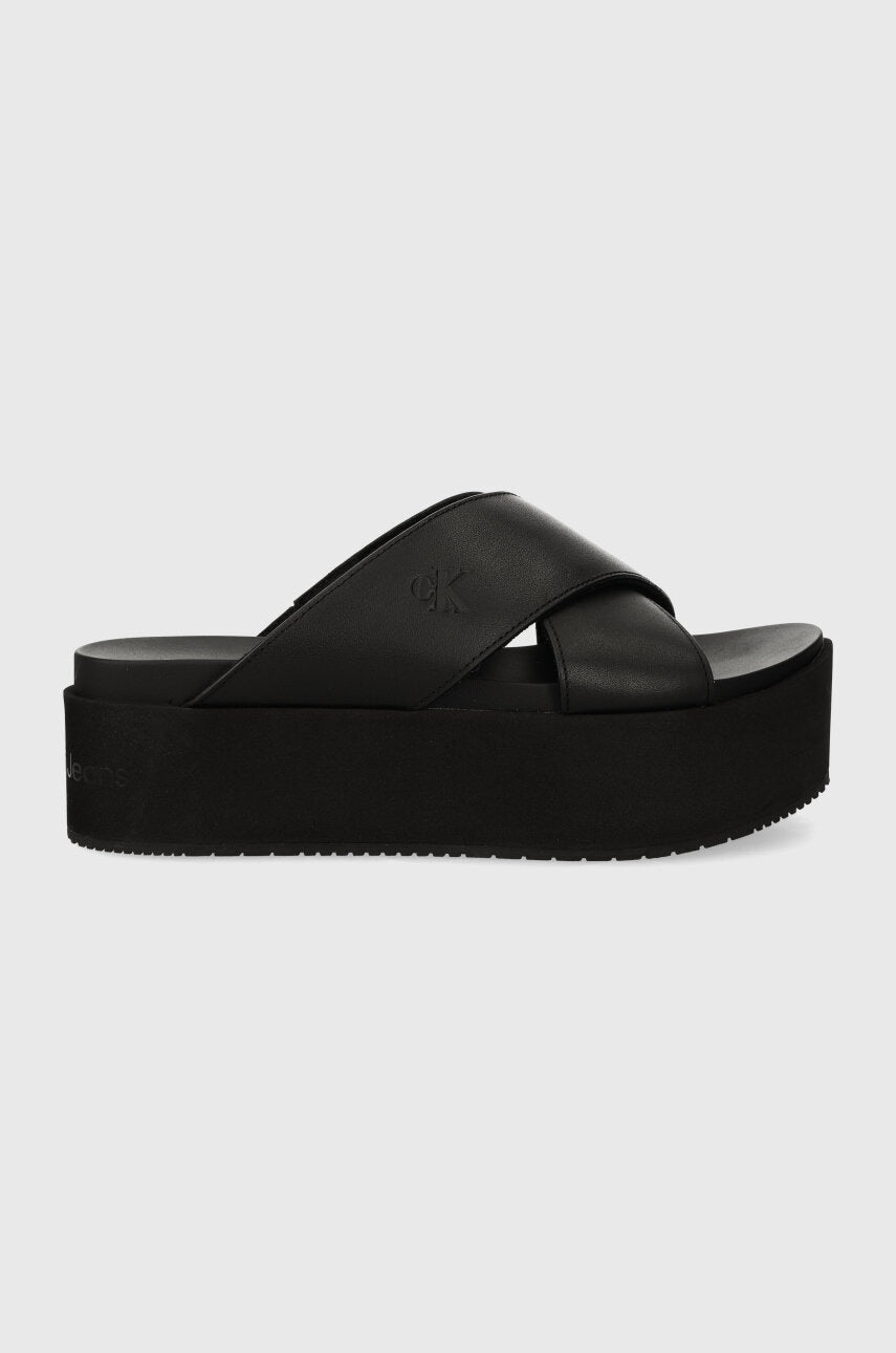 Kožne natikače Calvin Klein Jeans FLATFORM CROSS MG UC za žene, boja: crna, s platformom, YW0YW01349