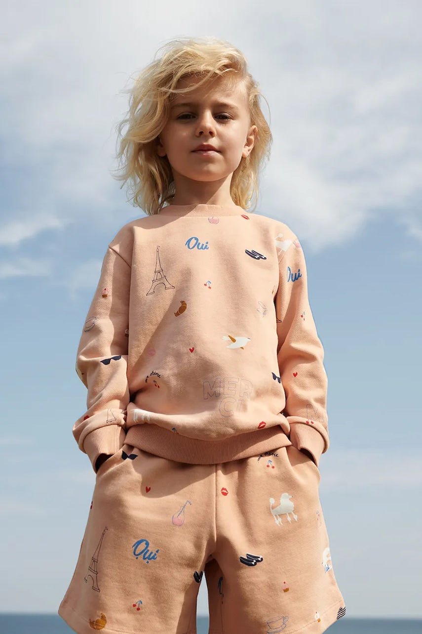 Otroške bombažne kratke hlače Liewood Gram Printed Sweatshorts oranžna barva, LW19864