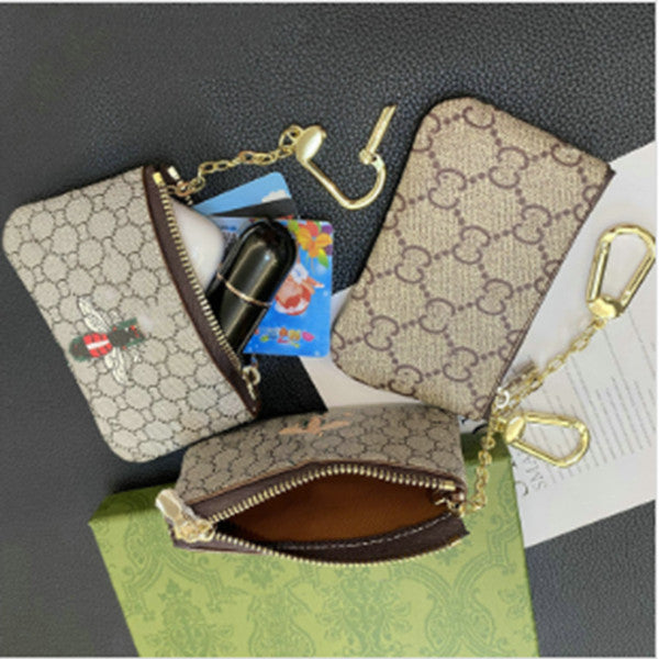 Designers luxurys Purses KEY POUCH POCHETTE CLES Women Mens Key Ring Credit Card Holder Coin Purses Mini Wallet Bag and dustbag 10a card holders des