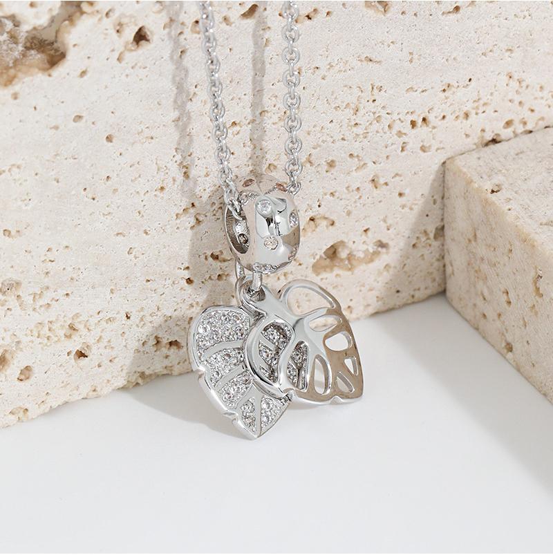 "Collana a pendente a foglia incrostata con diamante-design a foglia di albero a doppio strato minimalista, di fascia alta ed elegante"