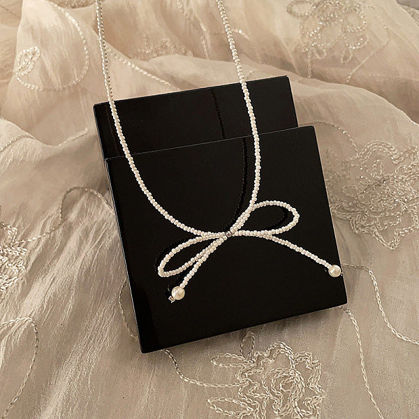 Collares colgantes con lazo y cuentas de resina y perlas para mujer