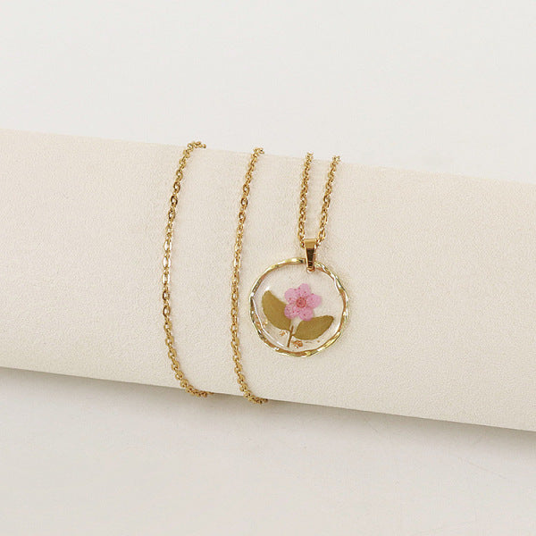 Collares colgantes redondos planos con flores interiores de aleación y plástico