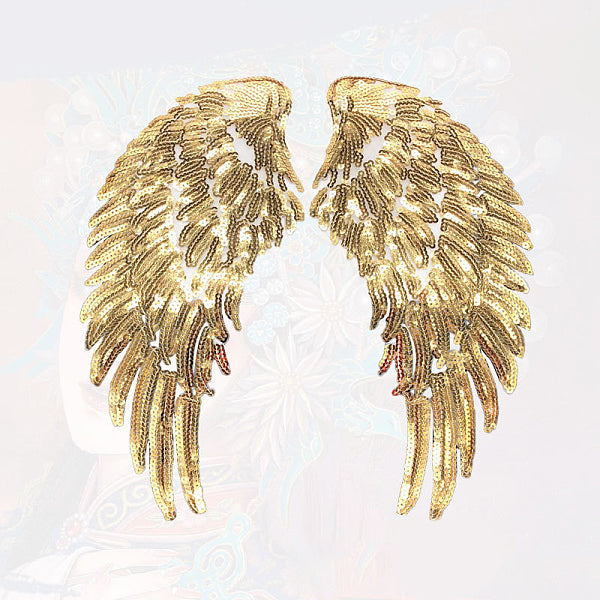 Toppe in tessuto glitterato con ali