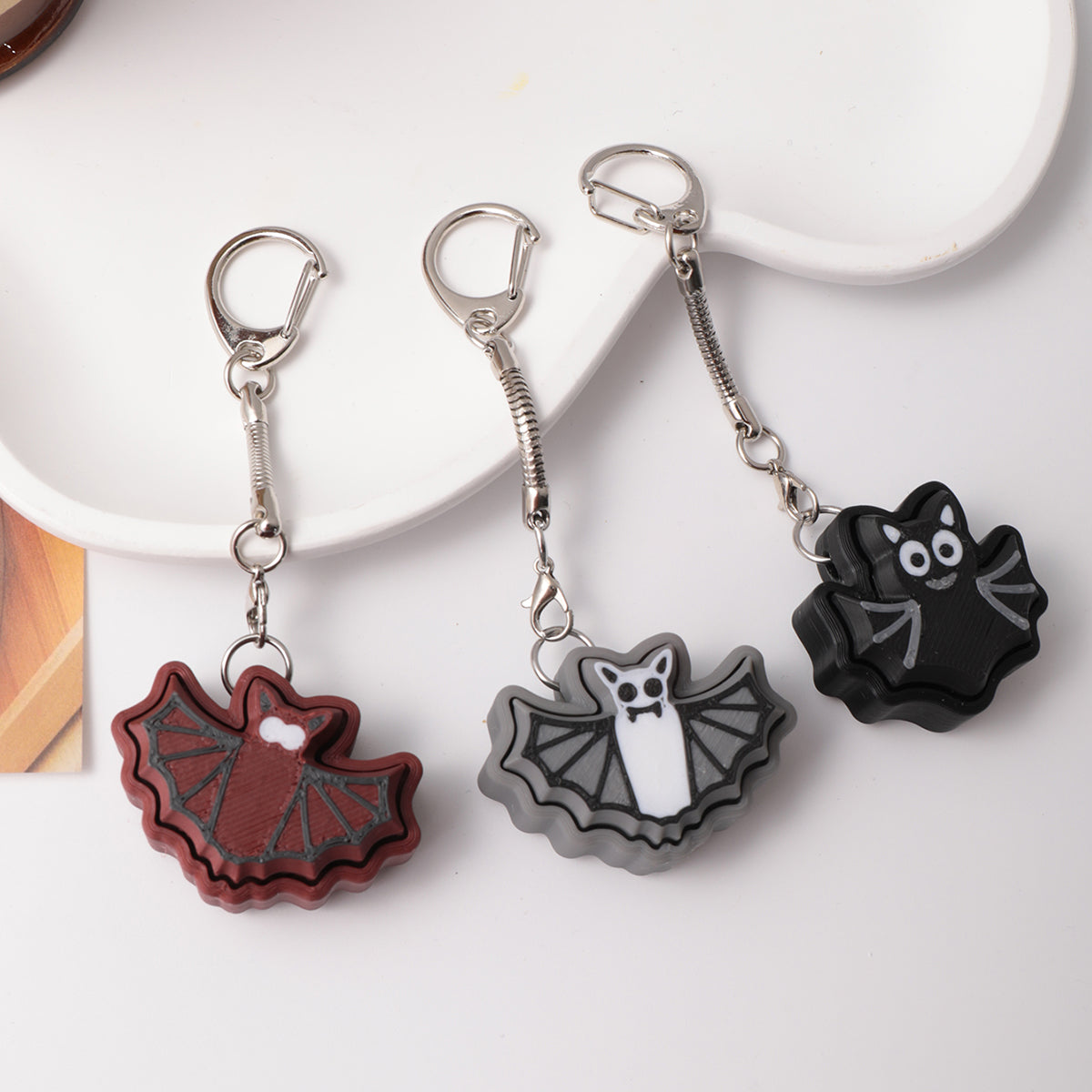 3D printed bat keychain - an adult stress relief toy with a portable anxiety-reducing gadget featuring a clickable keyboard design