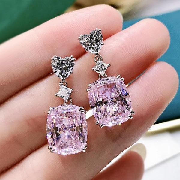 Boucles d'oreilles exquises de luxe à 4 griffes incrustées de pierres précieuses synthétiques artificielles à la mode pour les femmes participant à d