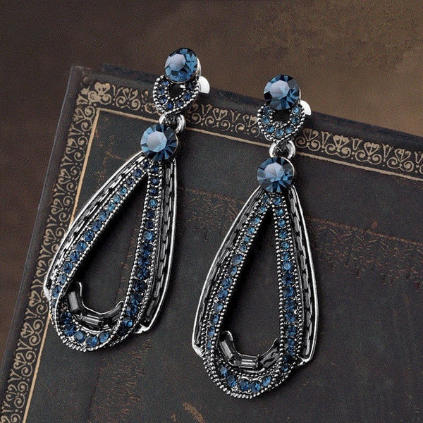 Boucles d'oreilles pendantes en argent vieilli et saphir