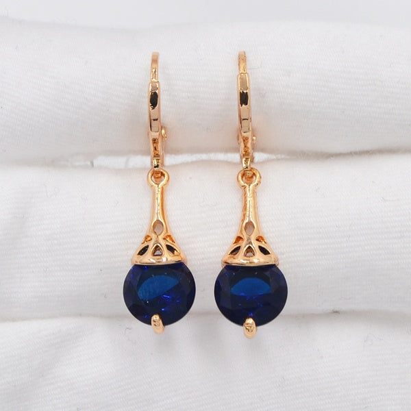 Boucles d'oreilles pendantes élégantes en zircone cubique ronde bleue