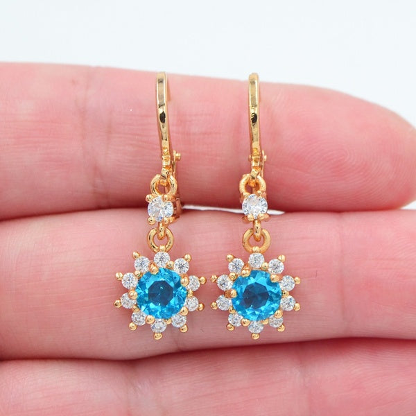 Boucles d'oreilles pendantes en forme de tournesol avec zircon cubique bleu lac pour femmes