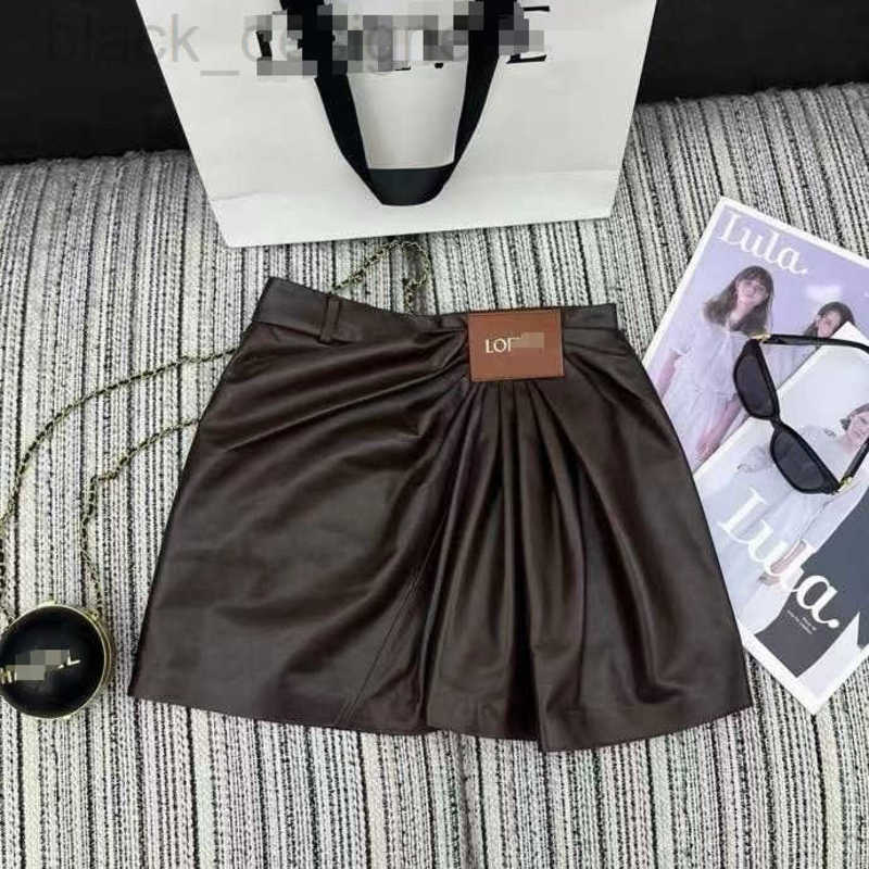 Skirts designer low2025 Summer New Little Sheepskin High Gloss Semi-Plant Wrinkled Design Letter Tag Embellished Short Skirt YMJE