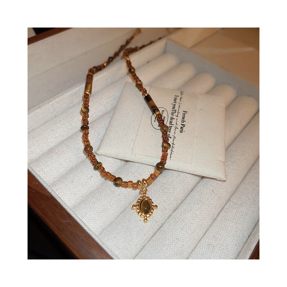 (Irregular tiger's eye rice bead necklace) Titanium steel natural stone pearl sun necklace, retro ethnic style, niche collarbone chain, light luxury,