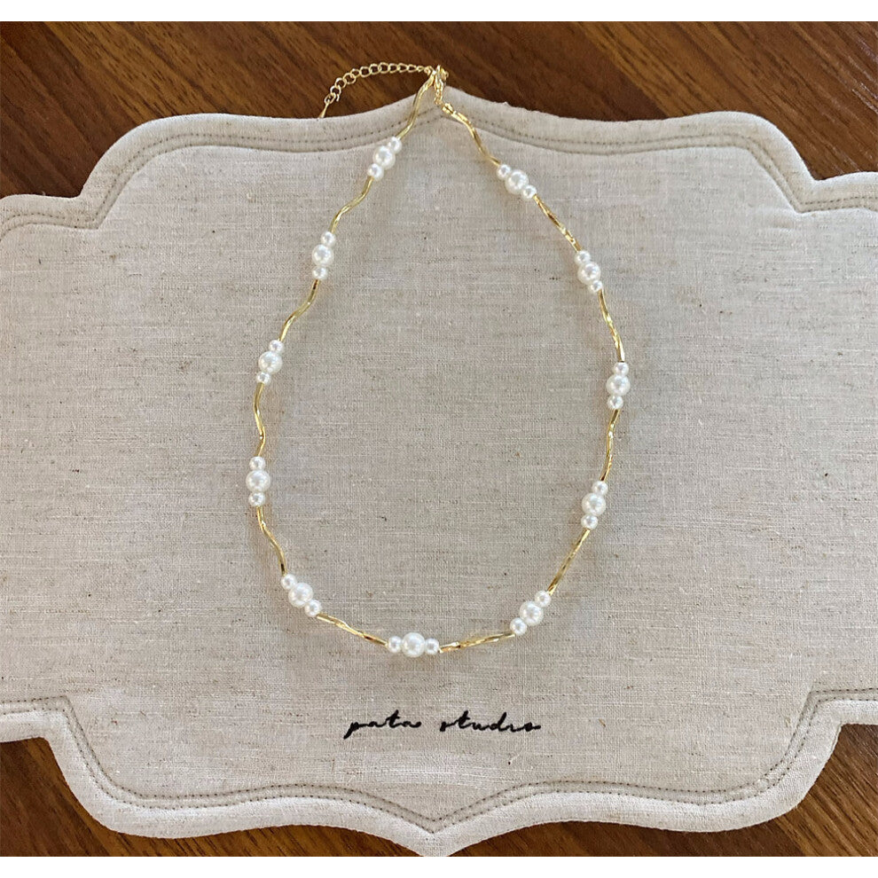 (Irregular gold pearl necklace) New imitation pearl silver bow necklace fashionable niche design clavicle chain versatile necklace