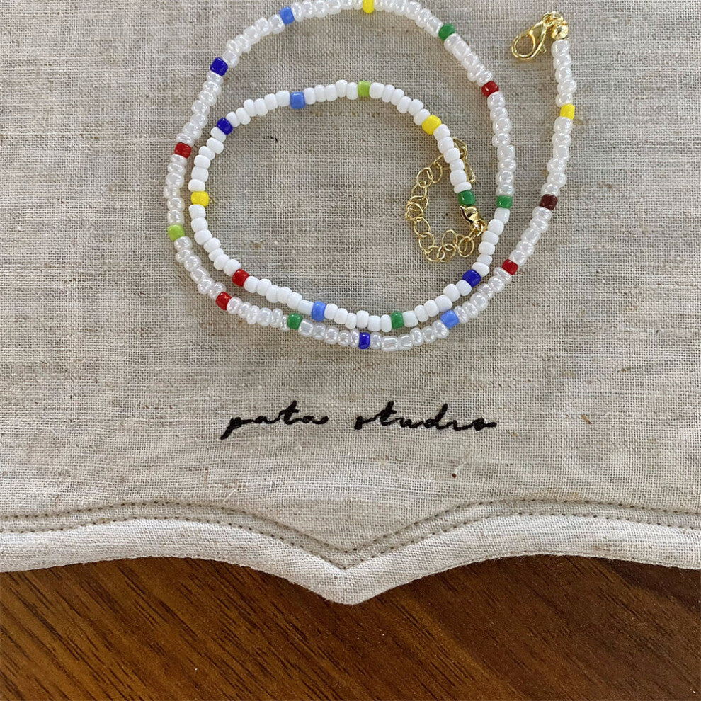 (Colorful white beaded necklace) New ribbon bow imitation pearl necklace fashionable niche design clavicle chain versatile necklace