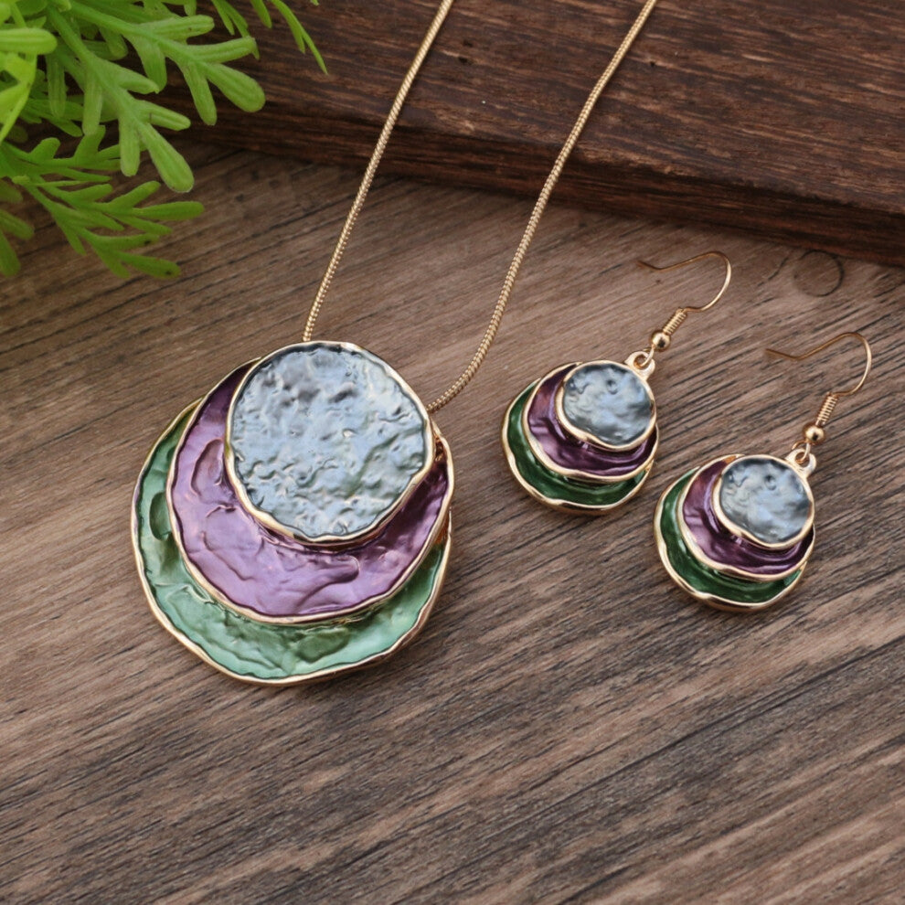 (Purple and Green Ring Set - Gold) A set of Bohemian women's accessories featuring a three-layer circular hollowed-out pendant earrings with colorful