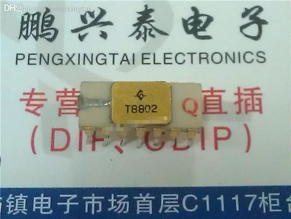 T8802 , Gold surface white ceramic package . Vintage chips - Collection Collectible , CDIP-14 pin - IC