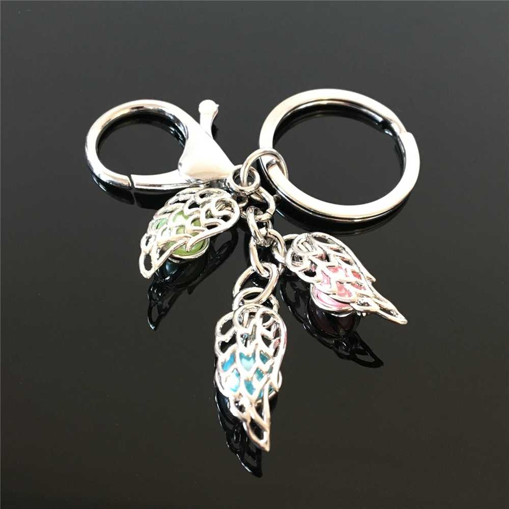 European and American feather pearl cage key ring can open hollow noctilucent volcanic stone pendant keyring