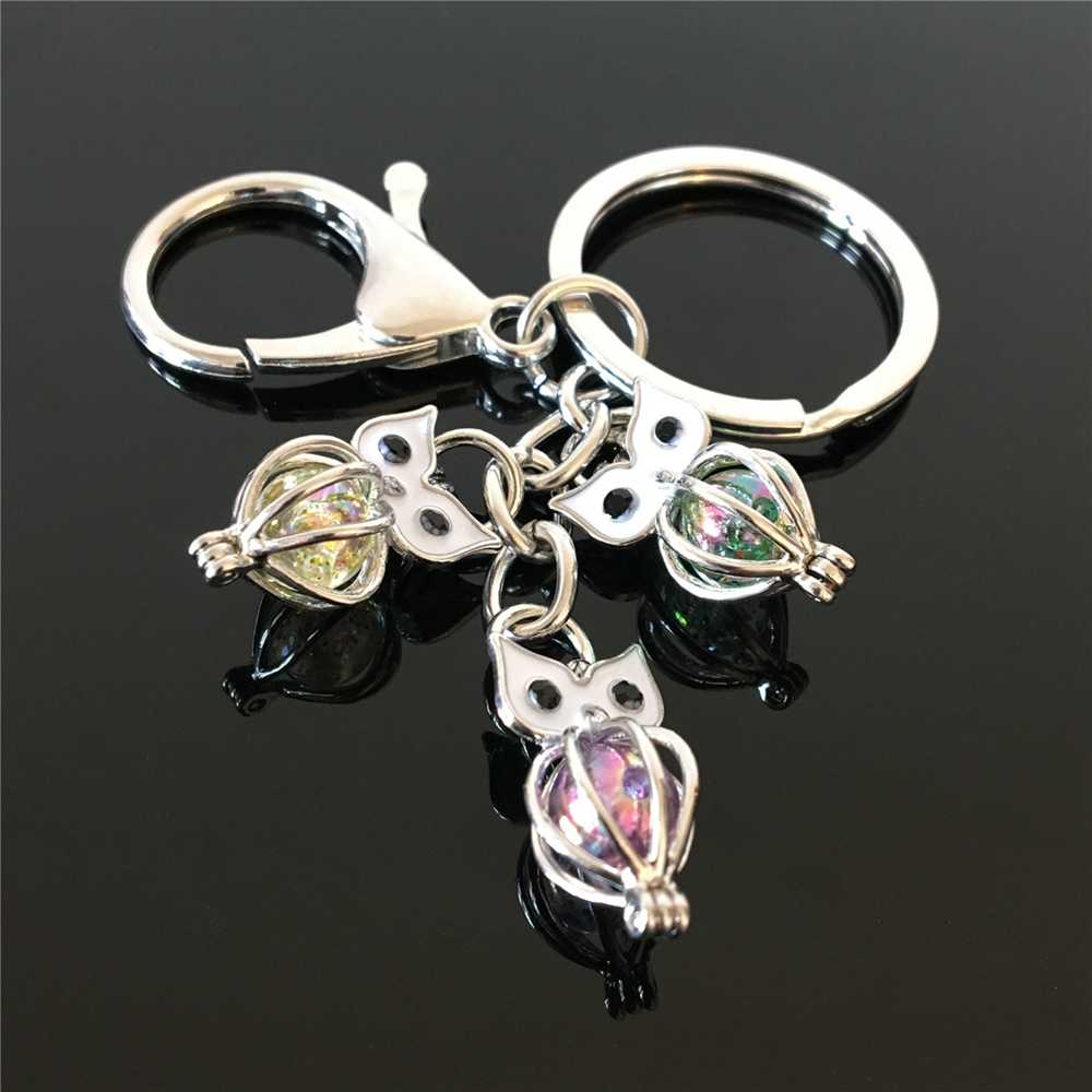 Euro-American owl pearl cage key ring can open hollow noctilucent volcanic stone pendant keyrings
