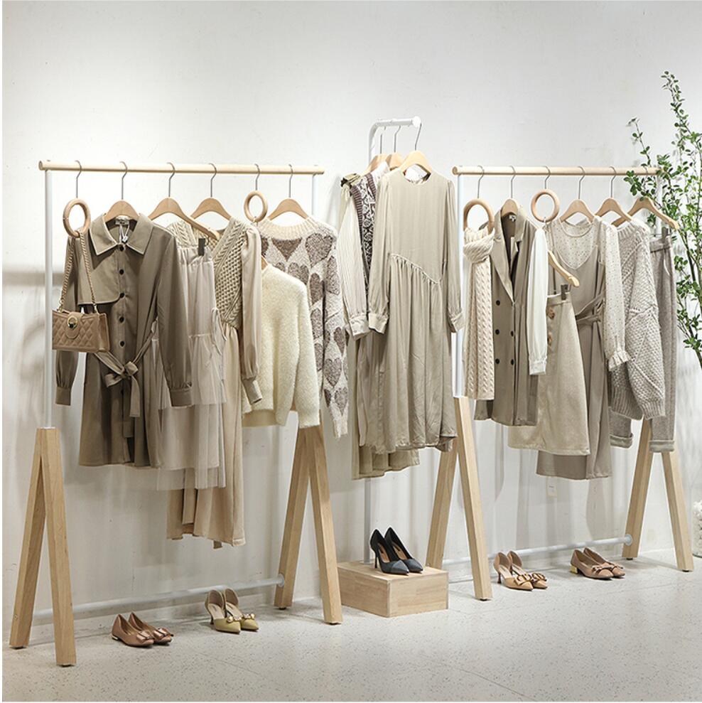 Clothing store display rack women&#039;s cloth shop hanging Organization shoe bag racks landing against the wall clothes Storage Holders white